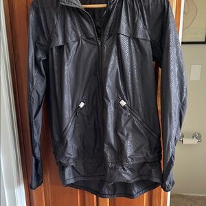 Lululemon wind breaker coat with front zip pockets and drawstring at bottom